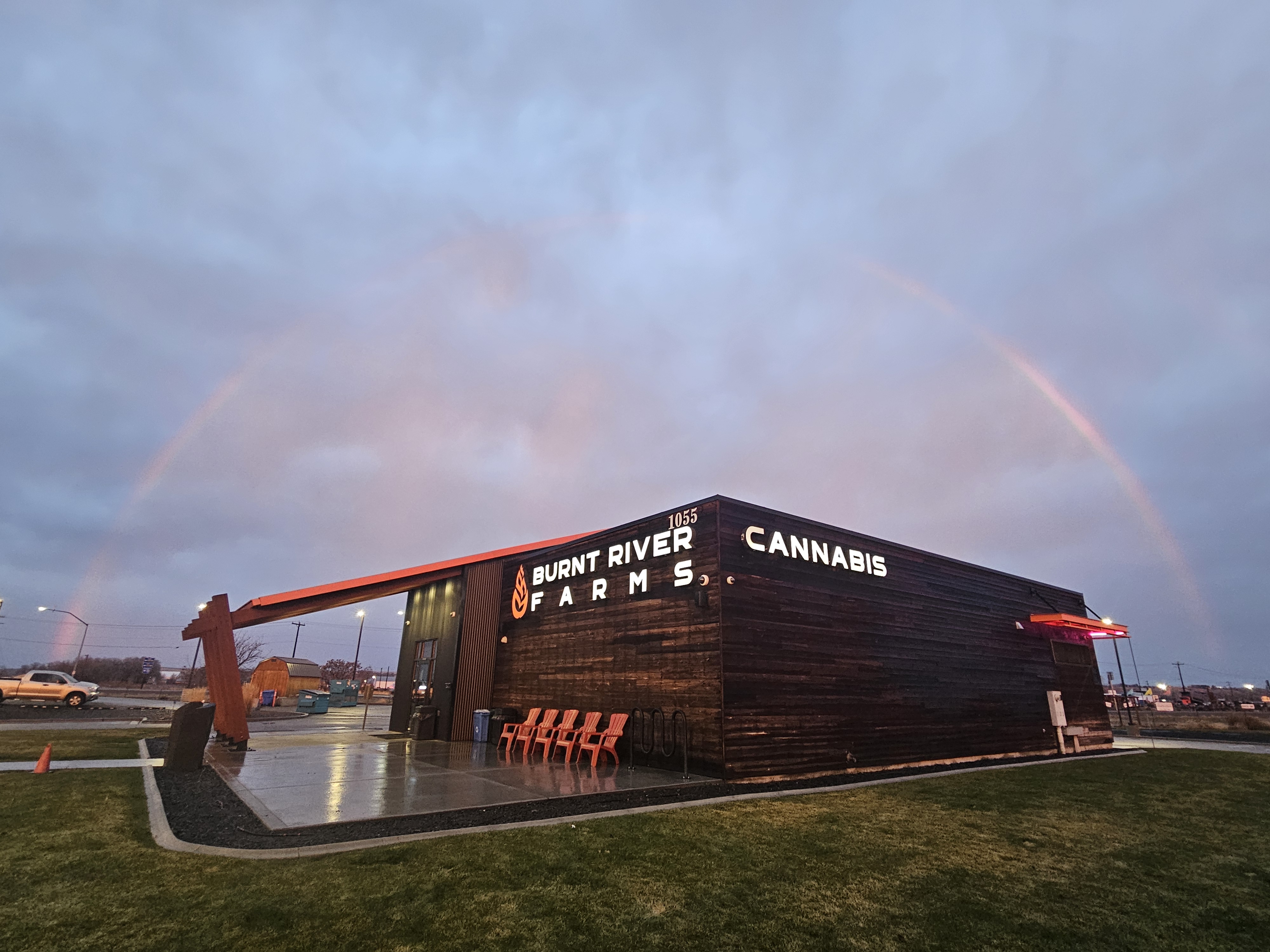 Burnt River Farms Building in the Rain with a Rainbow in it.